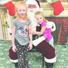 Saturday was Santa Claus and shop local day in Karlstad. Willow and Gracelynn Mather enjoyed there visit with Santa . Santa Claus Day was sponsored by the Karlstad Lions Club.