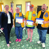 Lion District Governor, Kami Anderson, initiated Holly Mantei, Jennifer Kasprowicz, and Scott Asmus as new members in the Karlstad Lions Club at their June meeting.