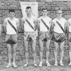 Track Team – Karlstad Public School – 1965, from left to right are Terry Johnson, Robert Clark, Buddy Fish, Kenny Gorsuch, John Sang, Roger Golby, Glen Kloempken, Mr. Duane Heck (coach)