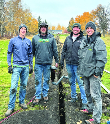 Volunteers Tyler Soltvedt-Director, Ryan Anderson-Superintendent, Ross Anderson-Director, and Brett Spilde-Director, prepare to put the finishing touches on the new sprinkler system at the Karlstad Golf Course.